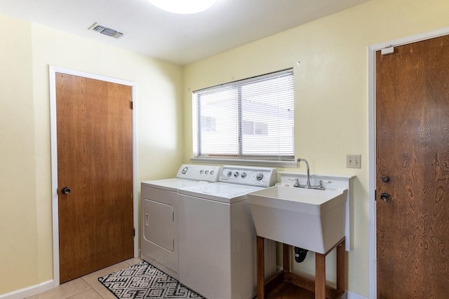 16895 Rd 30 1/2, Madera, CA 93636 - washroom with washing machine and clothes dryer, light tile patterned floors, and baseboards