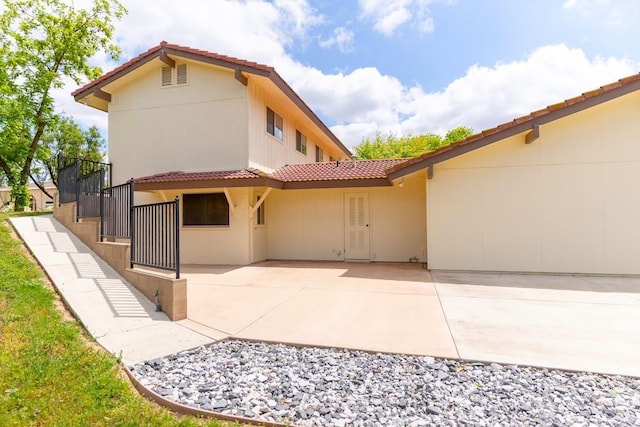 16895 Rd 30 1/2, Madera, CA 93636 - rear view of property featuring a tile roof, a patio, and stucco siding