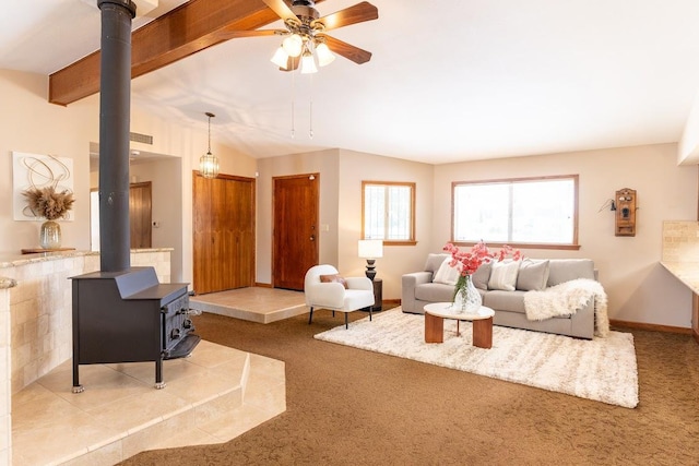 16895 Rd 30 1/2, Madera, CA 93636 - carpeted living room featuring ceiling fan, a wood stove, baseboards, and vaulted ceiling