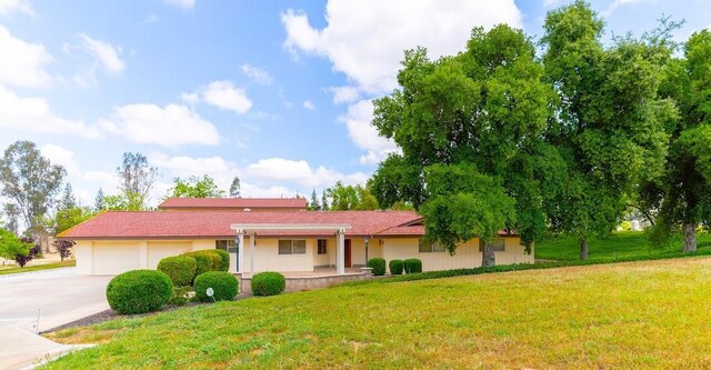 16895 Rd 30 1/2, Madera, CA 93636 - single story home with a garage, a front yard, driveway, and covered porch