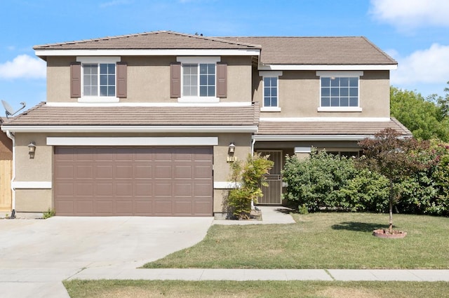 798 S Burgan Ave, Fresno, CA 93727 - view of front facade with a garage, driveway, a front yard, and stucco siding