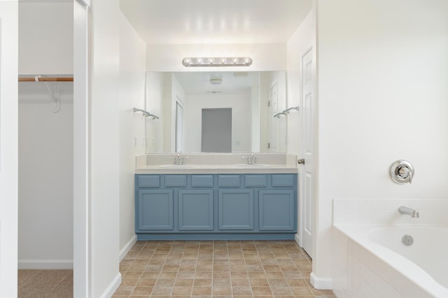 798 S Burgan Ave, Fresno, CA 93727 - full bath with a spacious closet, double vanity, and a tub
