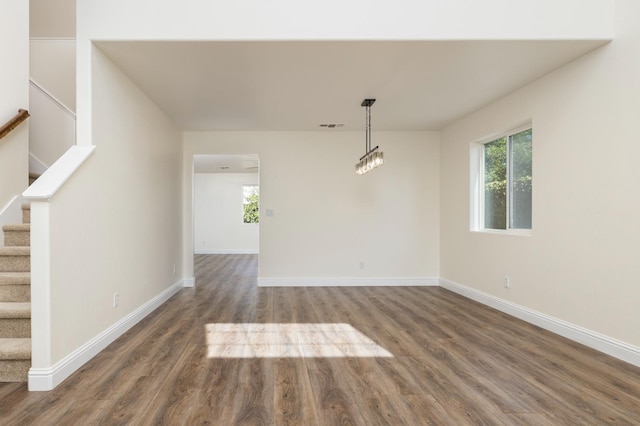 798 S Burgan Ave, Fresno, CA 93727 - unfurnished dining area with wood finished floors, healthy amount of natural light, baseboards, and stairway