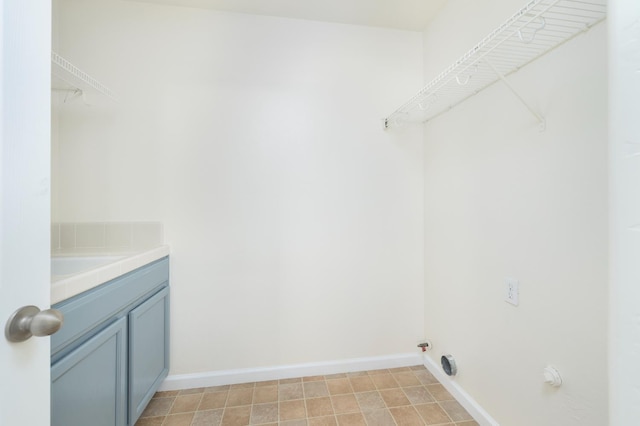 798 S Burgan Ave, Fresno, CA 93727 - washroom with cabinet space and baseboards