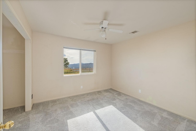 5664 Clouds Rst, Mariposa, CA 95338 - spare room with light carpet, a ceiling fan, and baseboards