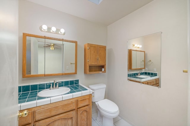 5664 Clouds Rst, Mariposa, CA 95338 - bathroom featuring toilet, tile patterned floors, ceiling fan, and vanity