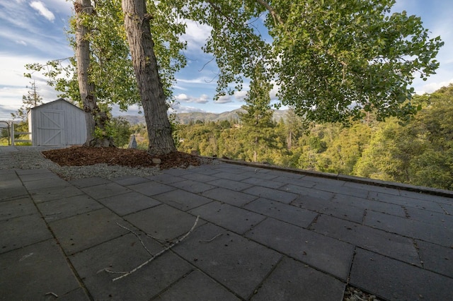 5664 Clouds Rst, Mariposa, CA 95338 - view of patio / terrace with a shed and an outdoor structure