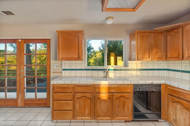 5664 Clouds Rst, Mariposa, CA 95338 - kitchen featuring healthy amount of natural light, tasteful backsplash, and a sink