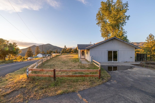 5664 Clouds Rst, Mariposa, CA 95338 - view of front of home with a mountain view and fence