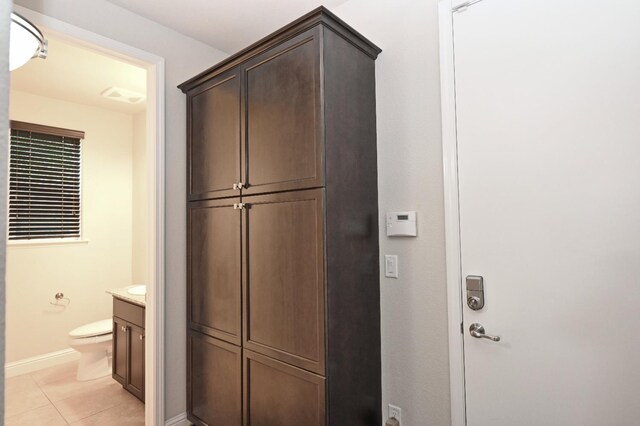 11332 N Cherry Sage Ave, Fresno, CA 93730 - bathroom with vanity, baseboards, toilet, and tile patterned flooring