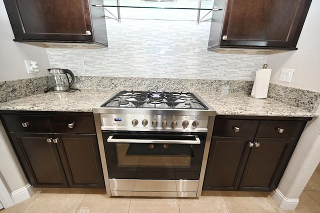 11332 N Cherry Sage Ave, Fresno, CA 93730 - kitchen with high end stainless steel range, dark brown cabinets, and light tile patterned floors