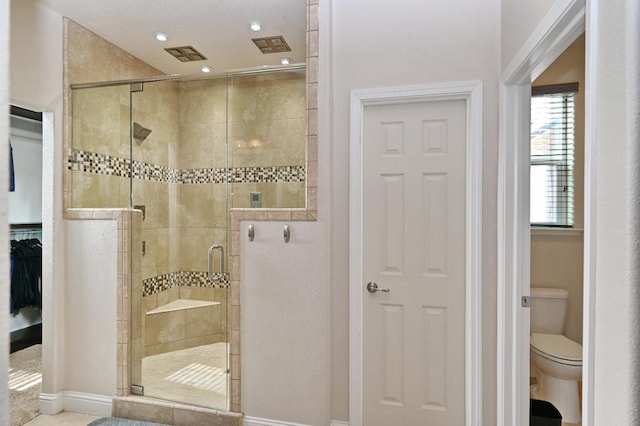 11332 N Cherry Sage Ave, Fresno, CA 93730 - bathroom with a shower stall, toilet, baseboards, and recessed lighting