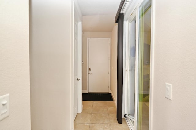 11332 N Cherry Sage Ave, Fresno, CA 93730 - corridor featuring light tile patterned floors