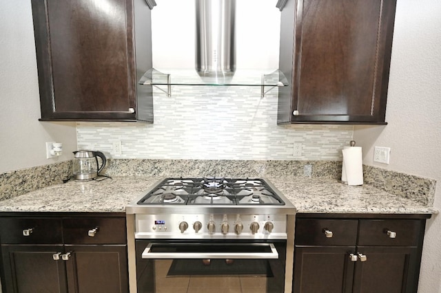 11332 N Cherry Sage Ave, Fresno, CA 93730 - kitchen featuring stainless steel gas stove, wall chimney exhaust hood, dark brown cabinets, and tasteful backsplash