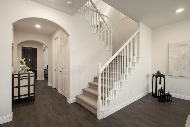 1362 E Via Viola Way, Fresno, CA 93730 - stairway featuring wood finished floors, arched walkways, baseboards, and recessed lighting