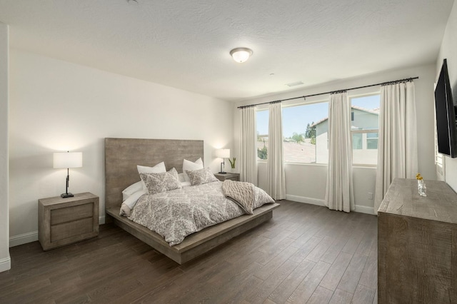 1362 E Via Viola Way, Fresno, CA 93730 - bedroom featuring baseboards and wood finished floors