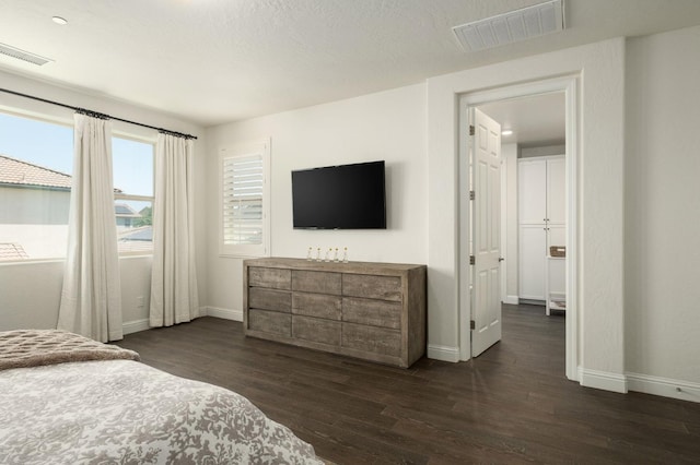 1362 E Via Viola Way, Fresno, CA 93730 - bedroom featuring baseboards and dark wood-style flooring
