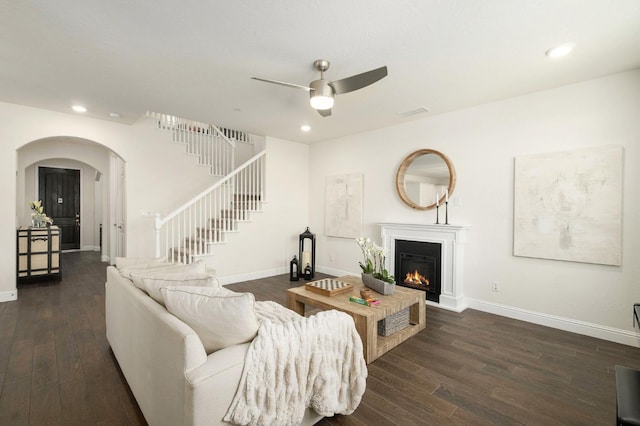1362 E Via Viola Way, Fresno, CA 93730 - living area featuring a ceiling fan, recessed lighting, arched walkways, dark wood-style flooring, and a glass covered fireplace