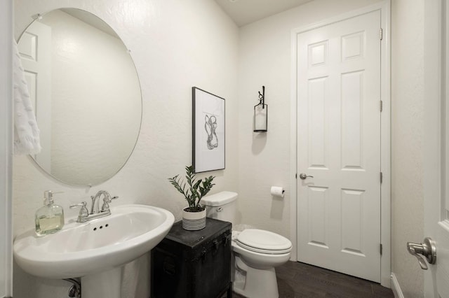 1362 E Via Viola Way, Fresno, CA 93730 - bathroom with wood finished floors, toilet, and a sink