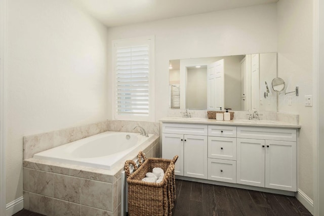 1362 E Via Viola Way, Fresno, CA 93730 - full bath with double vanity, a bath, and wood finished floors