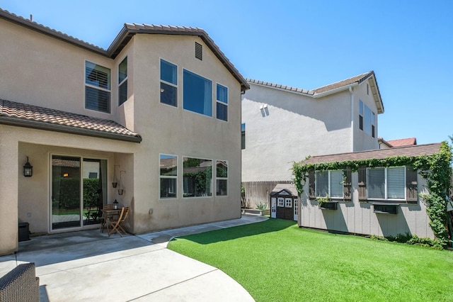 1362 E Via Viola Way, Fresno, CA 93730 - back of house with a patio, stucco siding, and a tiled roof