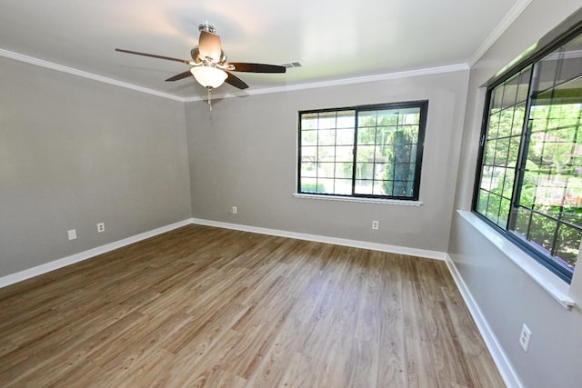 5088 N Forkner Ave, Fresno, CA 93711 - unfurnished room with healthy amount of natural light, ornamental molding, wood finished floors, and ceiling fan