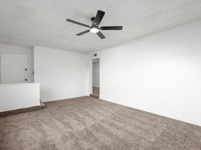 2332 S Jackson Ave, Fresno, CA 93725 - unfurnished room with carpet floors, a textured ceiling, baseboards, and a ceiling fan