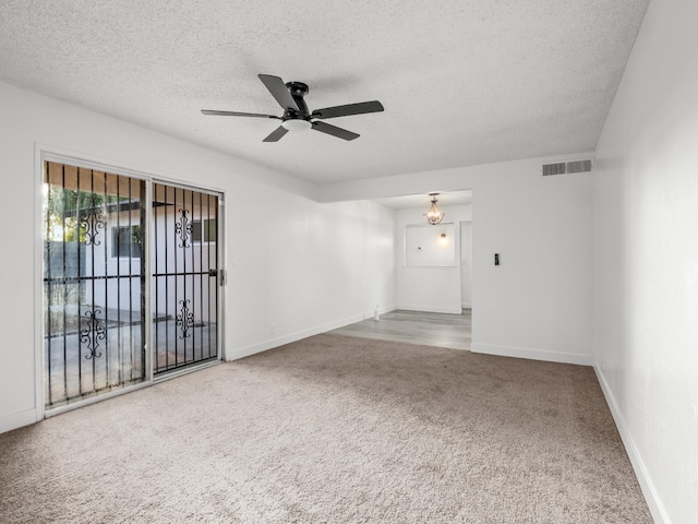 2332 S Jackson Ave, Fresno, CA 93725 - carpeted spare room featuring a ceiling fan, a textured ceiling, and baseboards