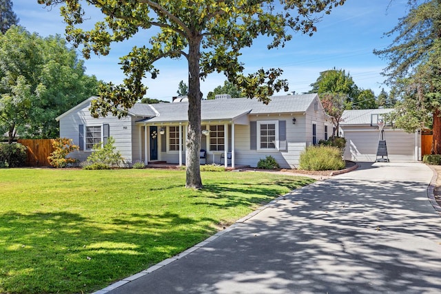 ranch-style home featuring an outbuilding and a porch