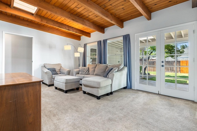 living area with wood ceiling, light colored carpet, beamed ceiling, healthy amount of natural light, and french doors