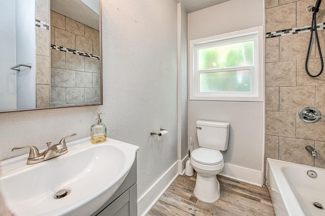 4487 E Bend Ave, Fresno, CA 93702 - bathroom with toilet, wood finished floors, baseboards, shower / tub combination, and vanity