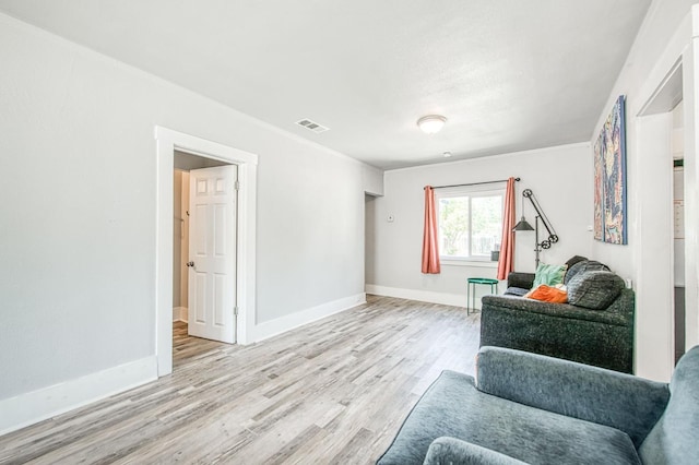 4487 E Bend Ave, Fresno, CA 93702 - living area featuring light wood-style floors and baseboards
