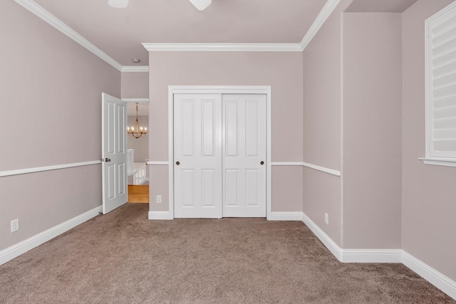 10717 N Bunkerhill Dr, Fresno, CA 93730 - unfurnished bedroom featuring ornamental molding, carpet, a chandelier, a closet, and baseboards