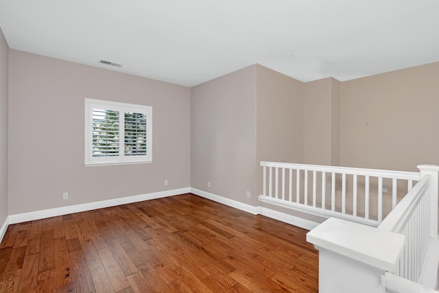 10717 N Bunkerhill Dr, Fresno, CA 93730 - empty room featuring hardwood / wood-style floors and baseboards