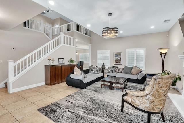10717 N Bunkerhill Dr, Fresno, CA 93730 - living room featuring stairway, tile patterned flooring, baseboards, a chandelier, and recessed lighting