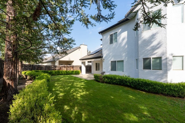 10717 N Bunkerhill Dr, Fresno, CA 93730 - view of yard featuring a patio area