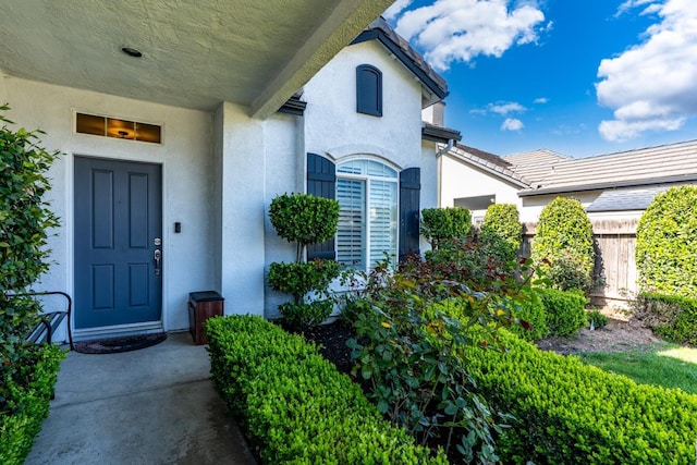 10717 N Bunkerhill Dr, Fresno, CA 93730 - entrance to property with stucco siding and fence