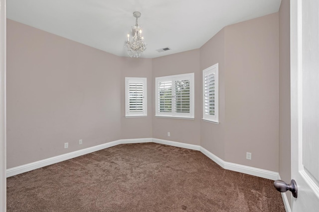 10717 N Bunkerhill Dr, Fresno, CA 93730 - spare room with carpet flooring, a chandelier, and baseboards