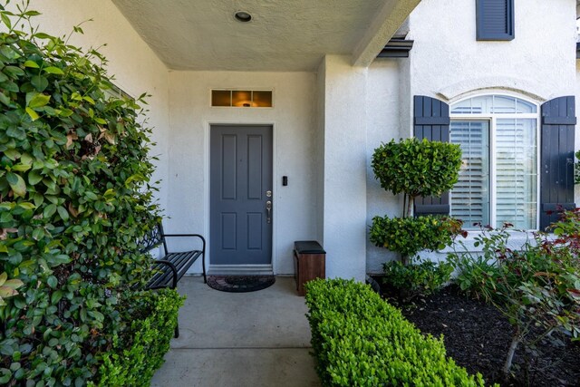 10717 N Bunkerhill Dr, Fresno, CA 93730 - view of exterior entry featuring stucco siding