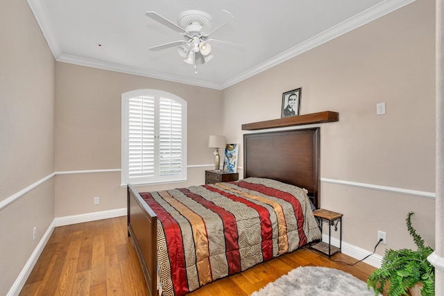 10717 N Bunkerhill Dr, Fresno, CA 93730 - bedroom featuring hardwood / wood-style flooring, ornamental molding, baseboards, and a ceiling fan