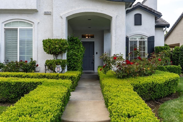 10717 N Bunkerhill Dr, Fresno, CA 93730 - entrance to property featuring stucco siding