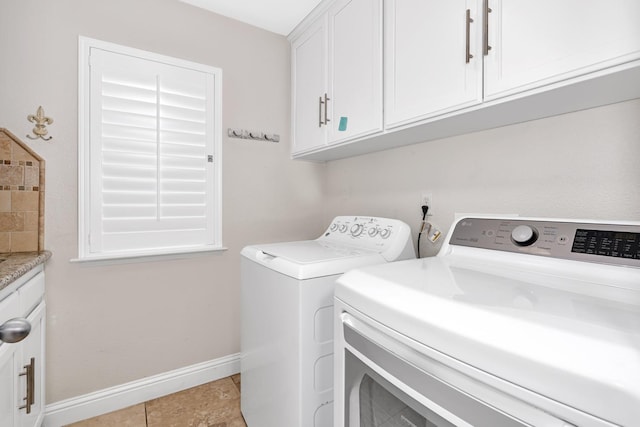 10717 N Bunkerhill Dr, Fresno, CA 93730 - clothes washing area with washing machine and clothes dryer, cabinet space, baseboards, and light tile patterned flooring