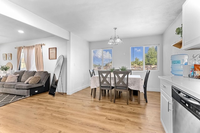 2157 Locust St, Selma, CA 93662 - dining area featuring a chandelier, light wood-style flooring, baseboards, and recessed lighting