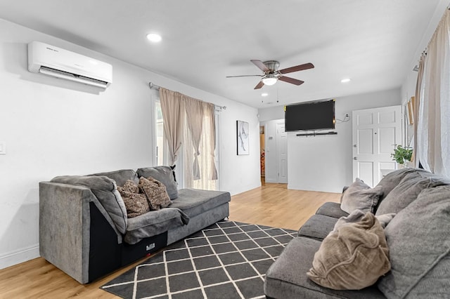 2157 Locust St, Selma, CA 93662 - living room with a wall mounted AC, recessed lighting, ceiling fan, baseboards, and light wood finished floors