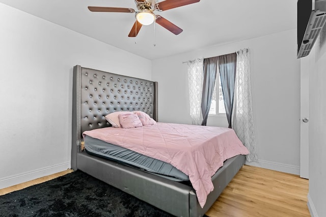 2157 Locust St, Selma, CA 93662 - bedroom featuring baseboards, wood finished floors, and ceiling fan