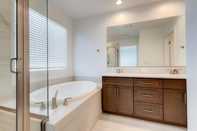 495 Thunder Rd S, Madera, CA 93636 - bathroom featuring a stall shower, a bath, double vanity, tile patterned flooring, and recessed lighting