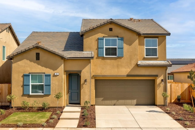 495 Thunder Rd S, Madera, CA 93636 - view of front of house featuring stucco siding, fence, an attached garage, a tiled roof, and concrete driveway