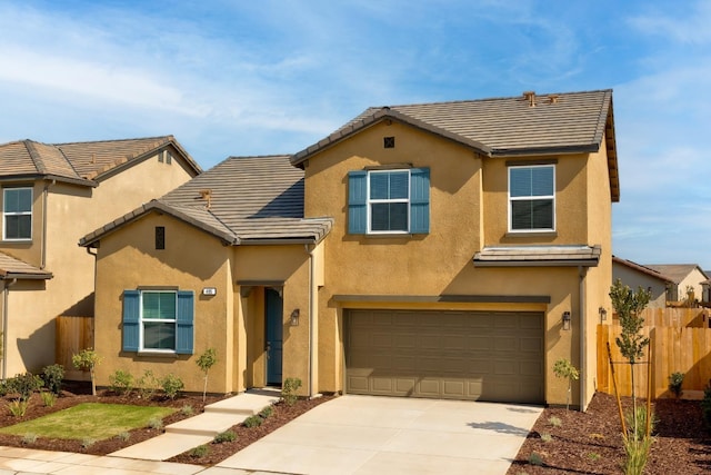 495 Thunder Rd S, Madera, CA 93636 - traditional home featuring fence, stucco siding, an attached garage, concrete driveway, and a tiled roof