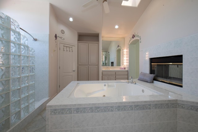 8067 E Belmont Ave, Fresno, CA 93737 - full bathroom with a garden tub, vanity, ceiling fan, tiled shower, and recessed lighting