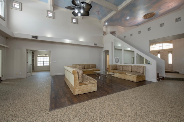 8067 E Belmont Ave, Fresno, CA 93737 - living room featuring a high ceiling, a ceiling fan, arched walkways, baseboards, and crown molding
